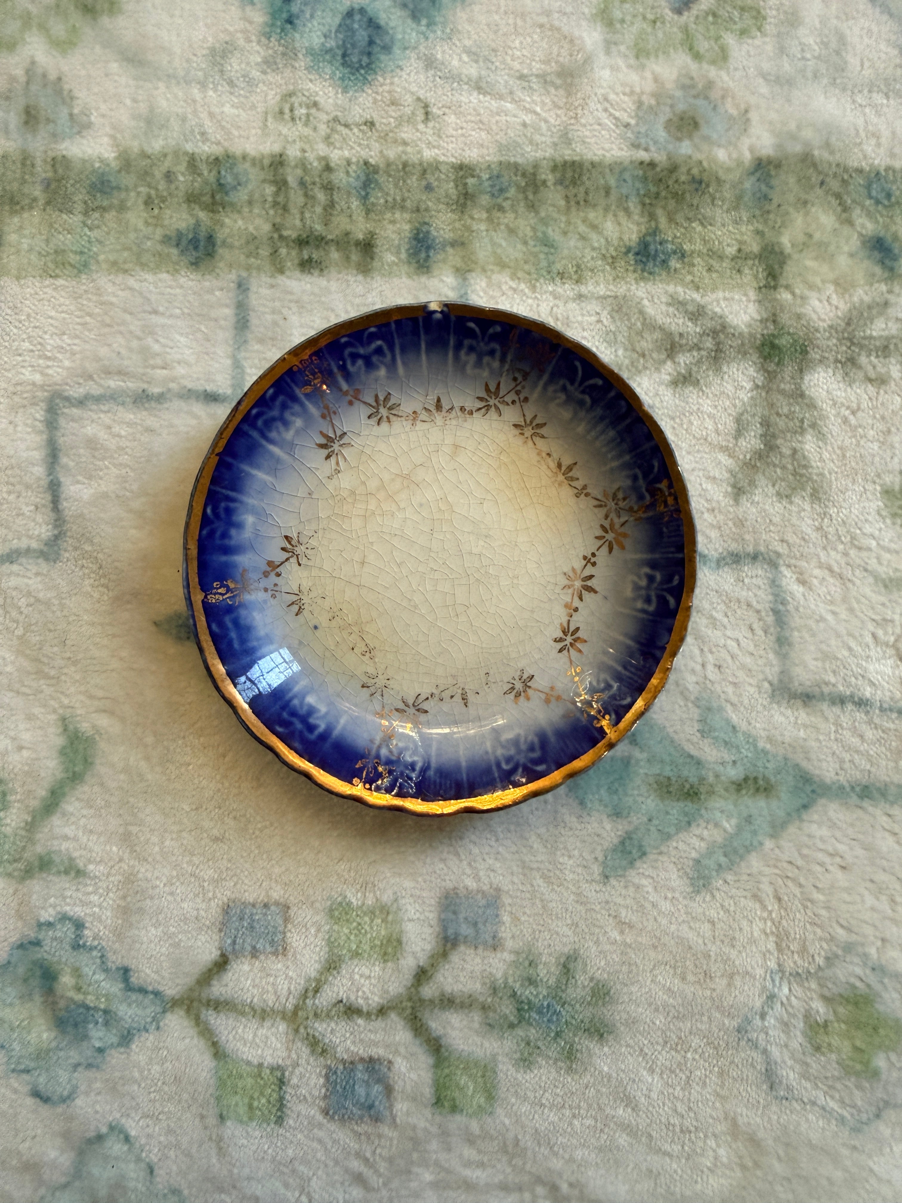 Antique Flow Blue 3” Butter Pat - small chip