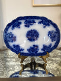 Antique Flow Blue New Wharf Pottery “Waldorf” Platter - 10 3/4” x 7 7/8” - antique condition with staining, crazing, and utensil wear